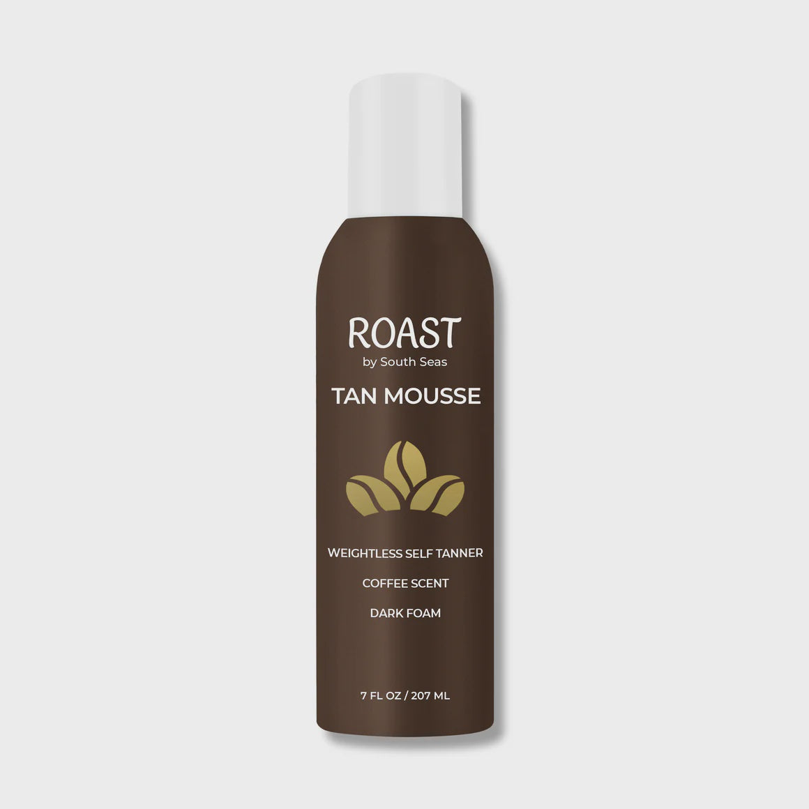 A bottle of "Roast Dark Tan Mousse" by South Seas Skincare, inspired by the serene vibes of a Scottsdale Arizona bungalow, is labeled as a weightless self-tanner with coffee scent, presented against a plain white background. The bottle holds 7 fluid ounces (207 mL).