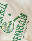 The Tennis Club Tee by Hunter Bell NYC is a white crew neck featuring a green HB Graphic Design with a tennis racket, ball, and bold "TENNIS CLUB ESTABLISHED 2006" lettering.