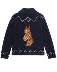 The Great Inc.’s Horse Lodge Cardigan is a navy blue knit sweater featuring white accents, a large brown horse head design on the back, and a wide collar for western-inspired charm.
