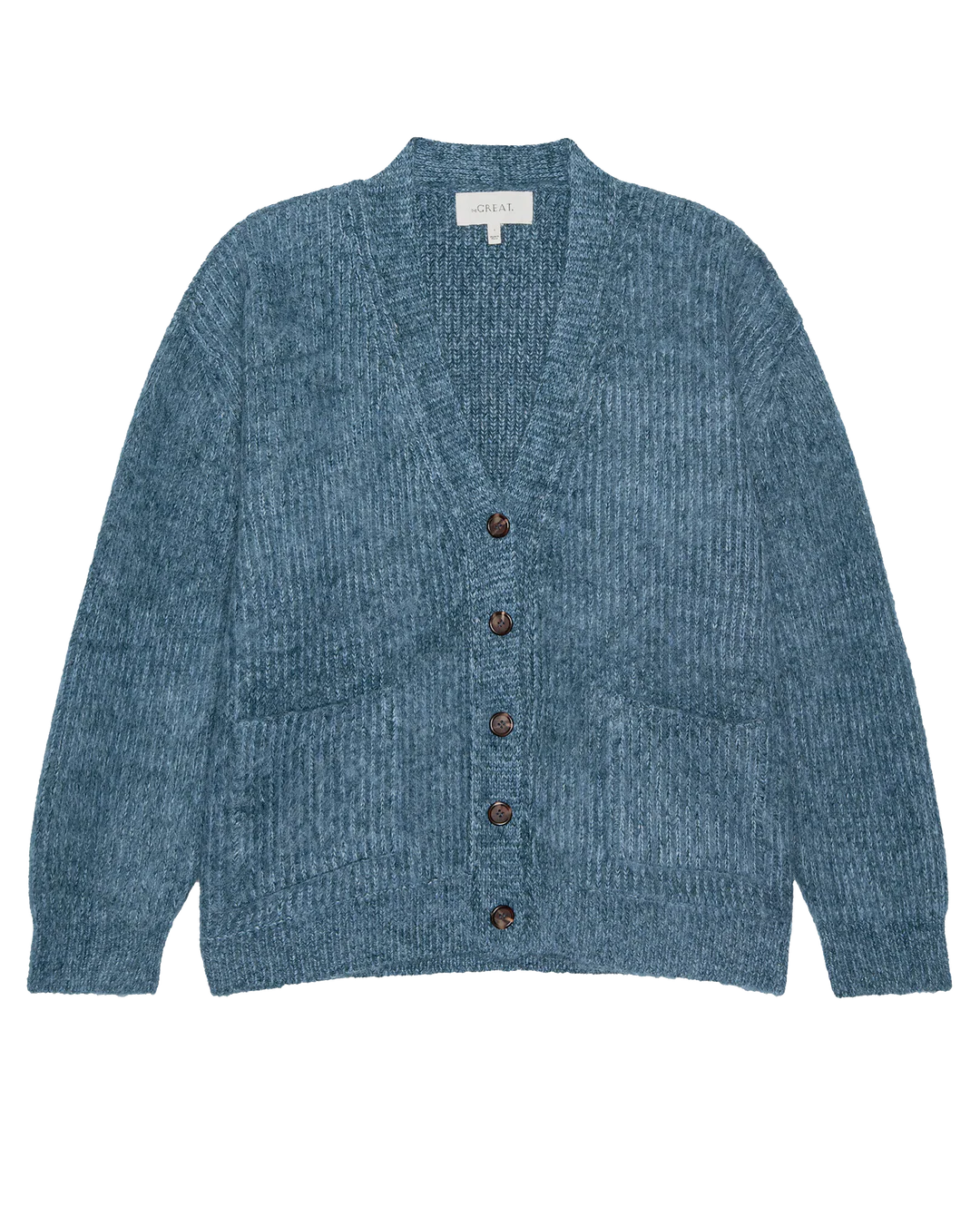 The Brushed Melange Cardigan by The Great Inc. is a blue wool blend with a V-neck, long sleeves, front pockets, and five brown center buttons, shown laid flat on a white background.