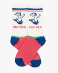 The Half-Calf Swim Club socks by Mother: white tube socks with red, green, and blue accents, bold mermaid graphic, and "MOTHER" on one sock and "FUCKER" on the other.
