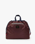Clare Vivier Sac Tout Navy tote with black handles, front zipper, and drawstring sides on white background.
