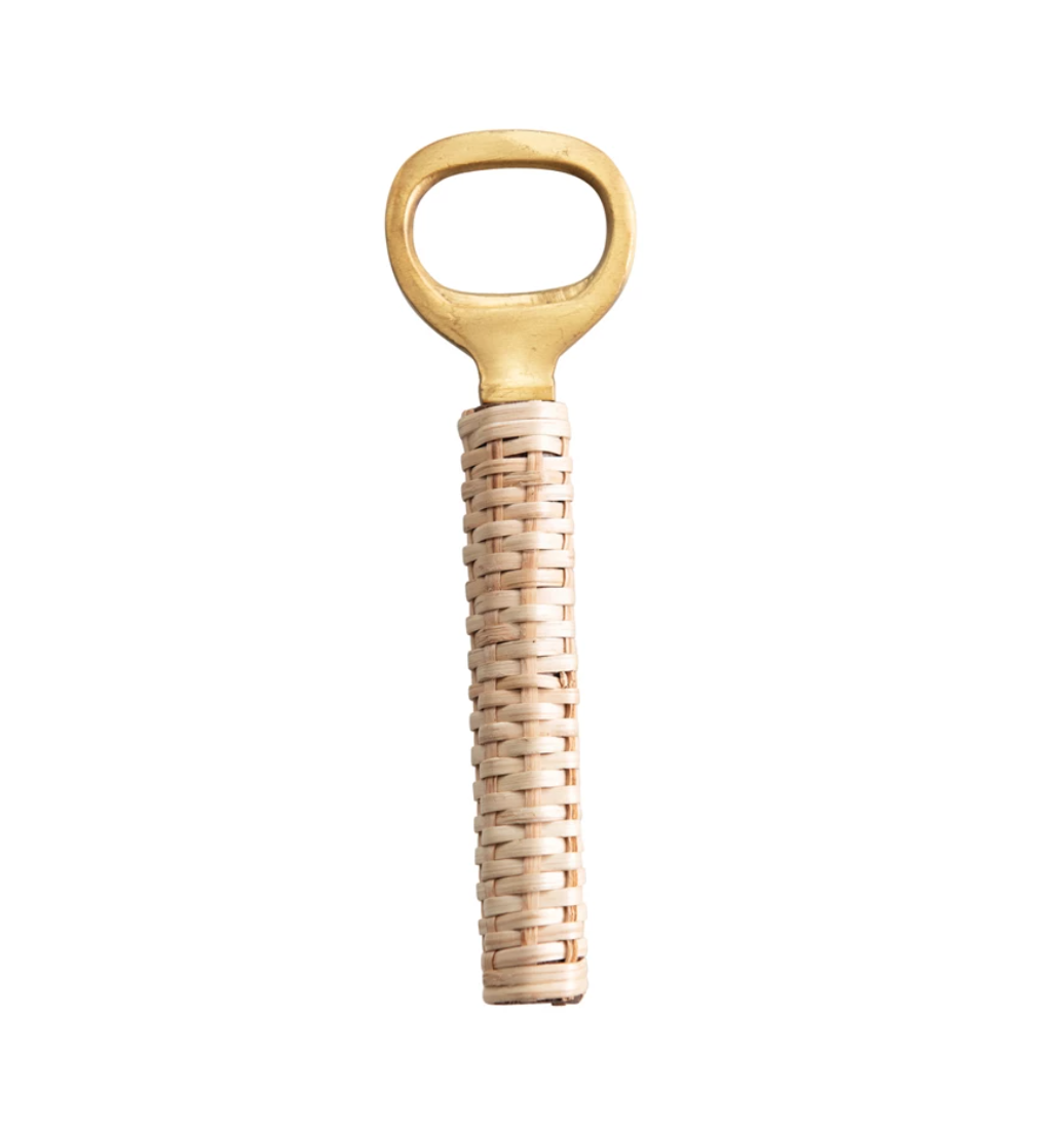 A Rattan Bottle Opener with a golden circular handle and a beige wicker-wrapped handle, isolated on a white background, perfect for any Scottsdale Arizona bungalow.