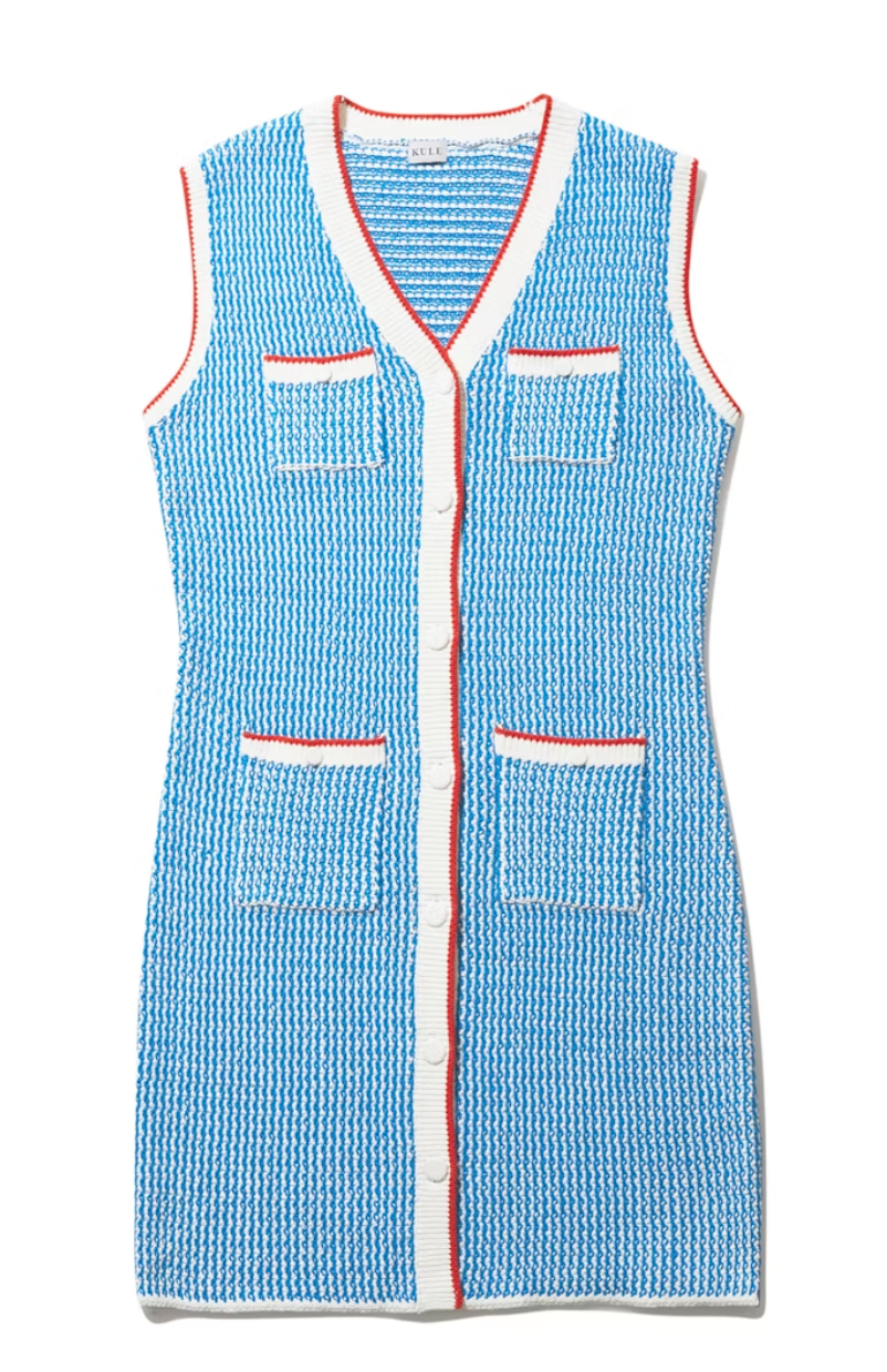 The Virginie White/Royal Blue knit vest with a V-neckline, featuring four front pockets trimmed with red, inspired by Scottsdale Arizona styles, and a front button closure by Kule.