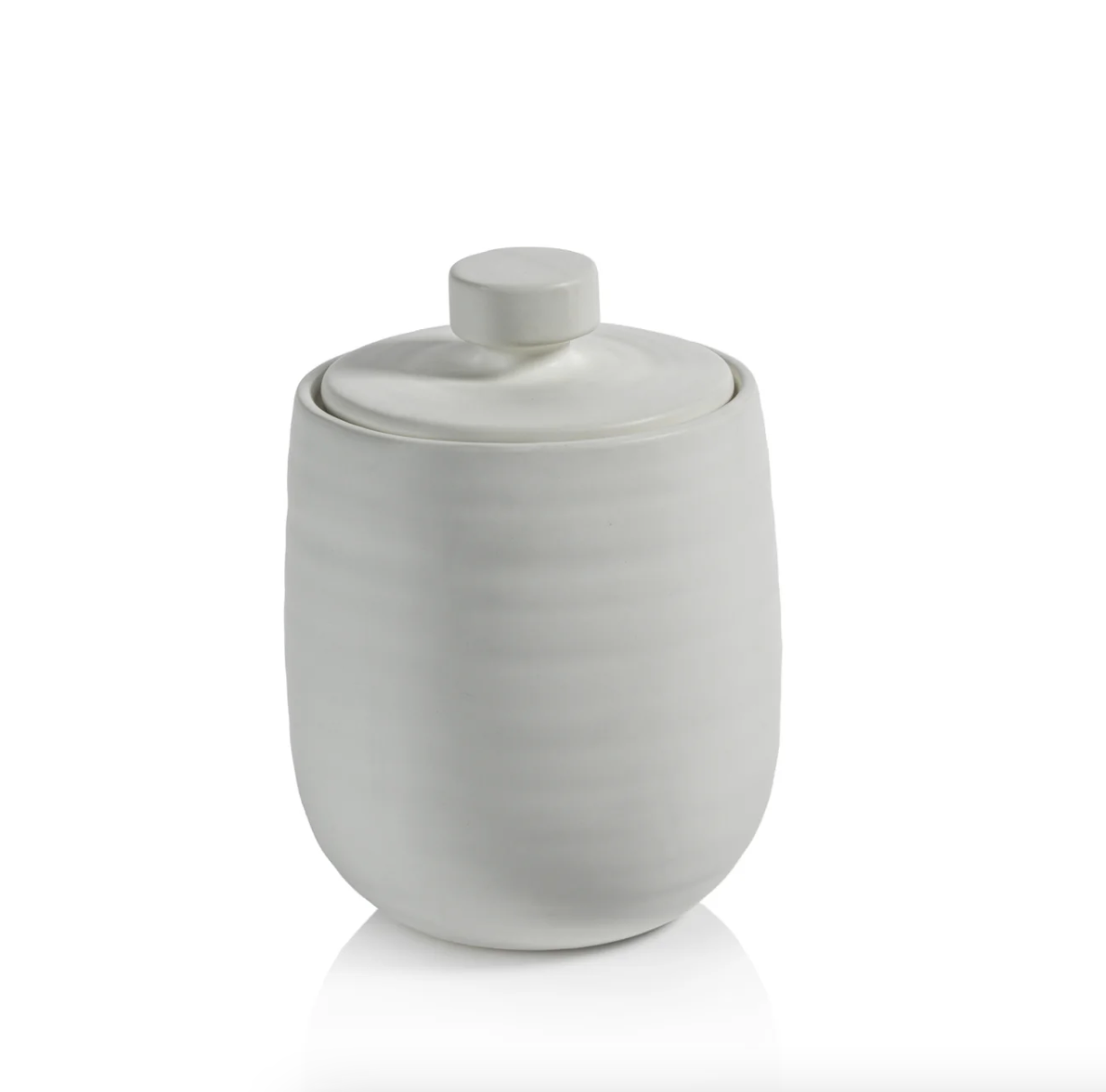 A simple white ceramic Arpège Lidded Jar - Small with a lid, featuring vertical grooves and a matte finish in Bungalow style, isolated on a white background. (Brand Name: Zodax)