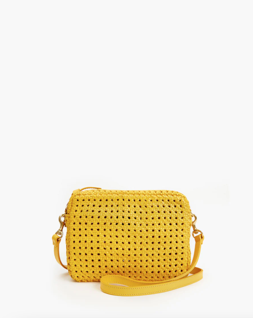 Yellow crochet crossbody bag with Clare Vivier style and a matching strap against a white background.