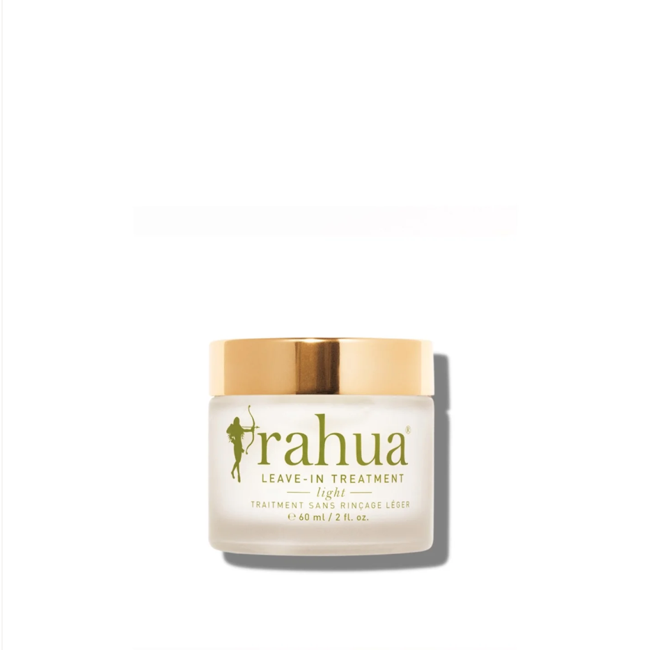 A jar of Faire Rahua Leave-in Treatment Light with a golden lid on a white background. The label features the Faire brand name and a green silhouette of a woman with flowing hair, reminiscent of the styles seen in Scottsdale Arizona.