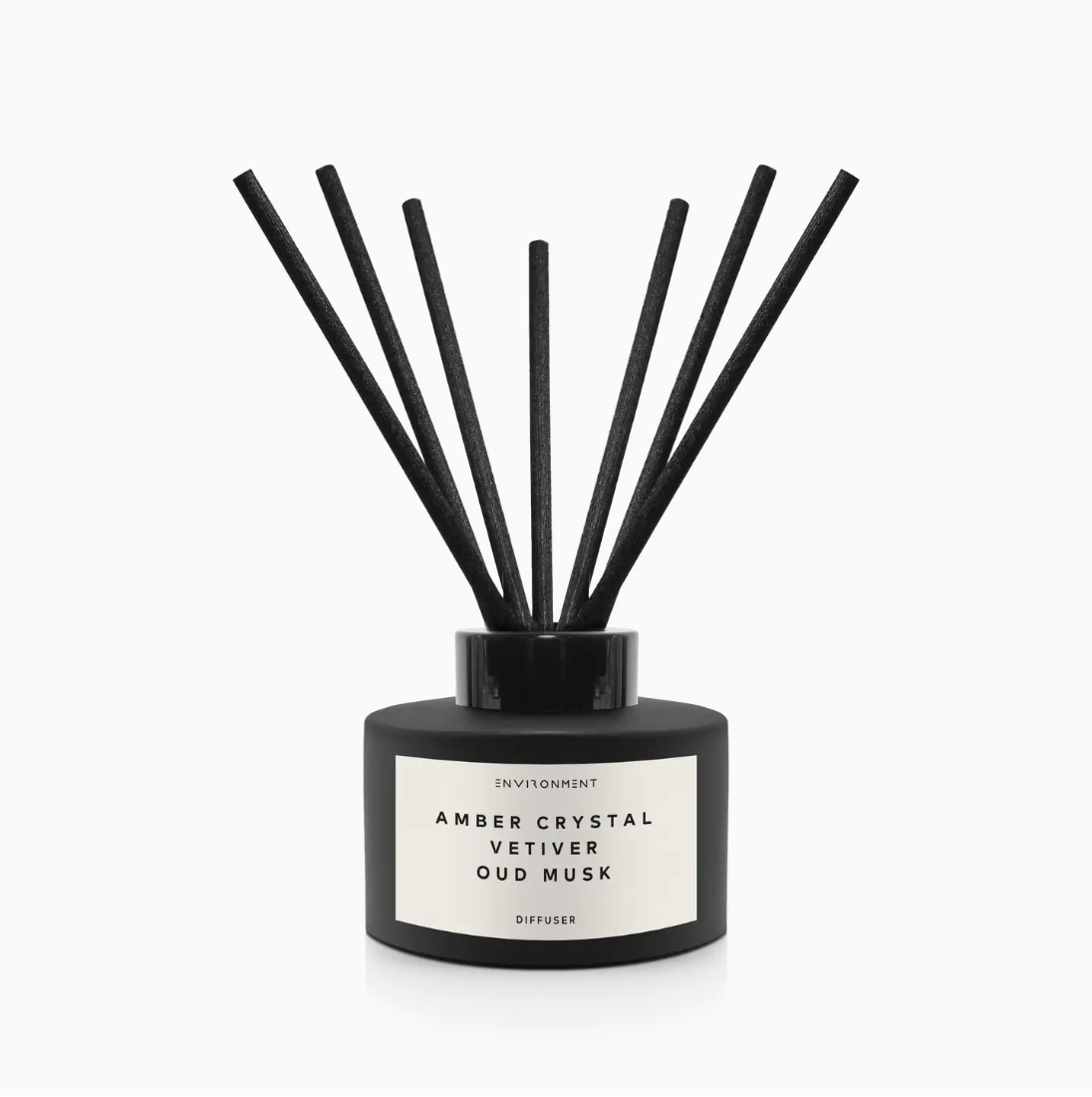 A black Faire aromatic diffuser with white text that reads &quot;Inspired By Baccarat Rouge 540® Diffuser Amber Crystal | Vet.&quot; It has several black sticks inserted into the square-shaped bottle, set against a white background.