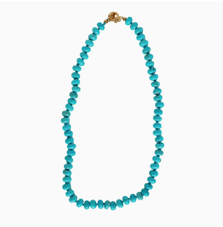A Genuine Turquoise Choker made of vibrant Arizona turquoise beads, arranged in a continuous loop, secured with a small golden clasp, isolated on a white background by Faire.