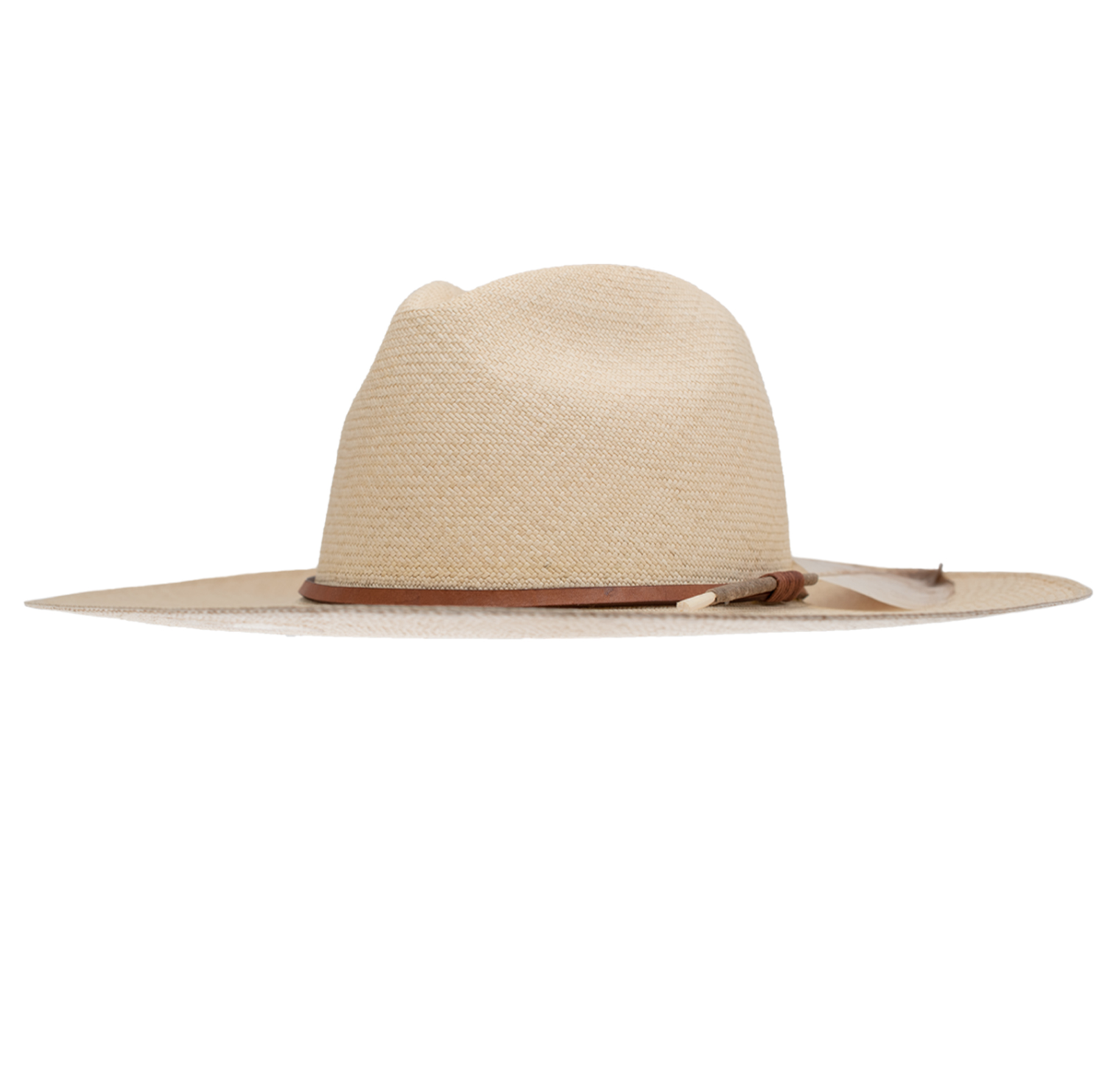 A wide-brimmed Ninakuru Matteo Extra Long Brim S/M hat made from sustainably harvested oquilla straw with a beige color and brown leather band around the base, isolated on a white background.