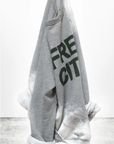 The FREECITY BLEACHOUT RAGLAN by Free City (sparrow, LLC) is a gray raglan sweatshirt with green "FREE CITY" lettering and lighter tie-dye effect cuffs. Made in the USA and hand-screen printed. "freecitysupershop" is shown at the bottom.