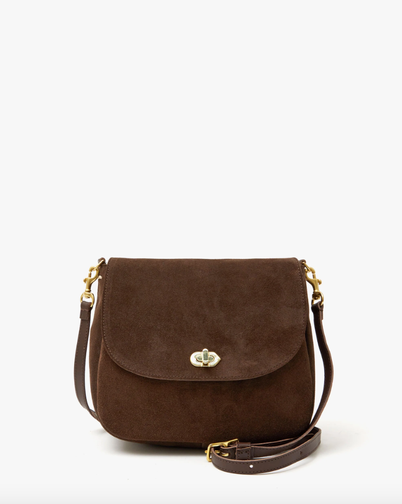 A brown suede crossbody bag with a gold clasp and an adjustable strap, featuring Arizona style, isolated on a white background by Clare Vivier's Turnlock Louis.