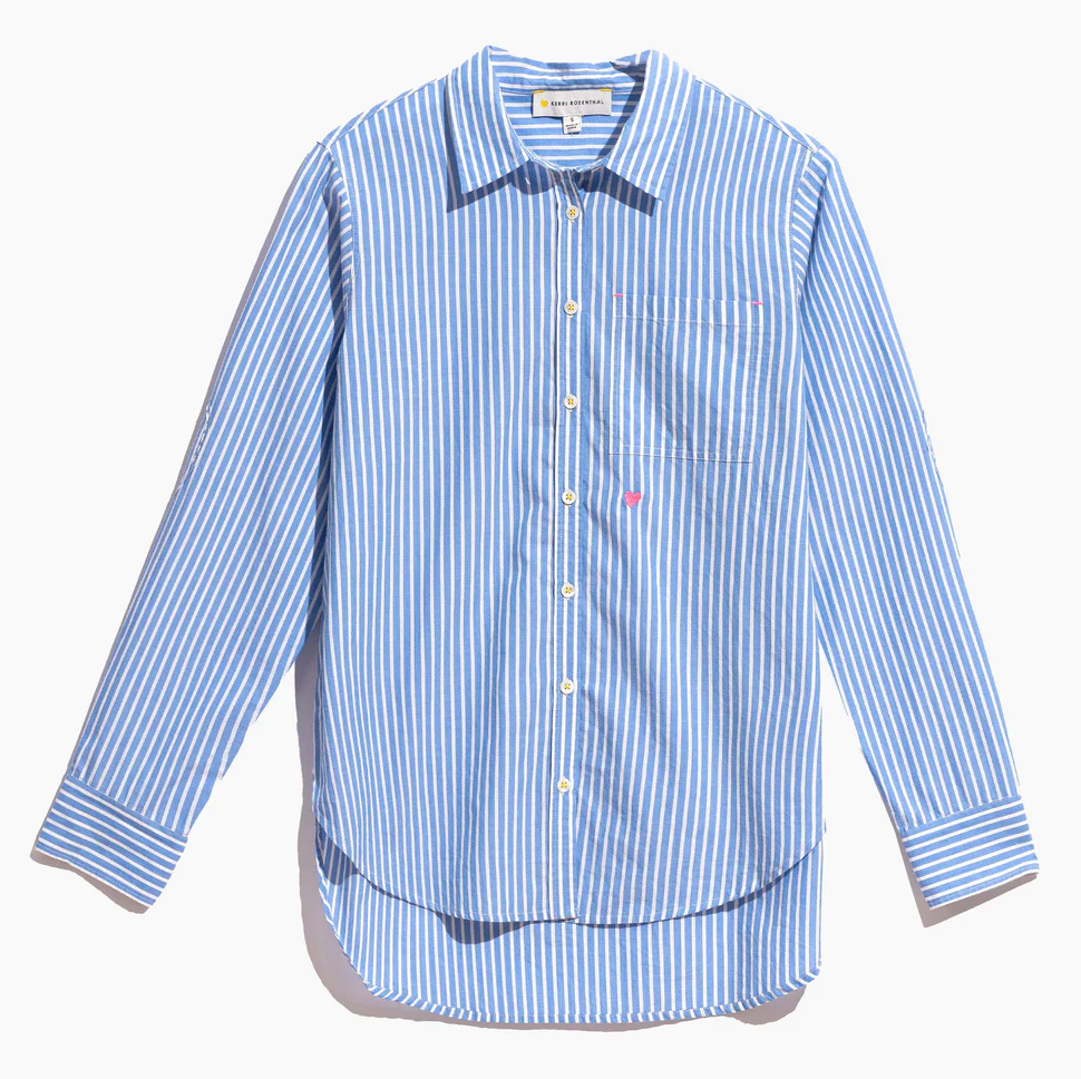 A Mia Shirt Stripe Blue/white Blue by Kerri Rosenthal, with long sleeves, a pocket on the left chest, and a small red logo. The shirt, featuring Arizona style, is spread out flat against a white background.