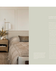 An open-plan living room in a Scottsdale, Arizona bungalow with light wooden floors and white walls, featuring a beige sofa, scattered cushions, a small tree decorated with lights, and minimalistic wooden furniture, radiating a calm, modern aesthetic from "Call It Home: The Details That Matter" by Random House.