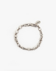 A Star Strand Bracelet Sterling Silver with intricate links and a heart-shaped charm inscribed with "Cheryl" in Arizona style on a white background. (Brand: Clare Vivier)