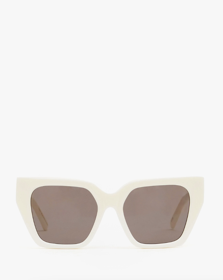 A pair of chic, oversized, Clare V. Heather sunglasses in cream featuring large, brown-tinted lenses and a bold, angular frame in Arizona style, isolated against a white background.