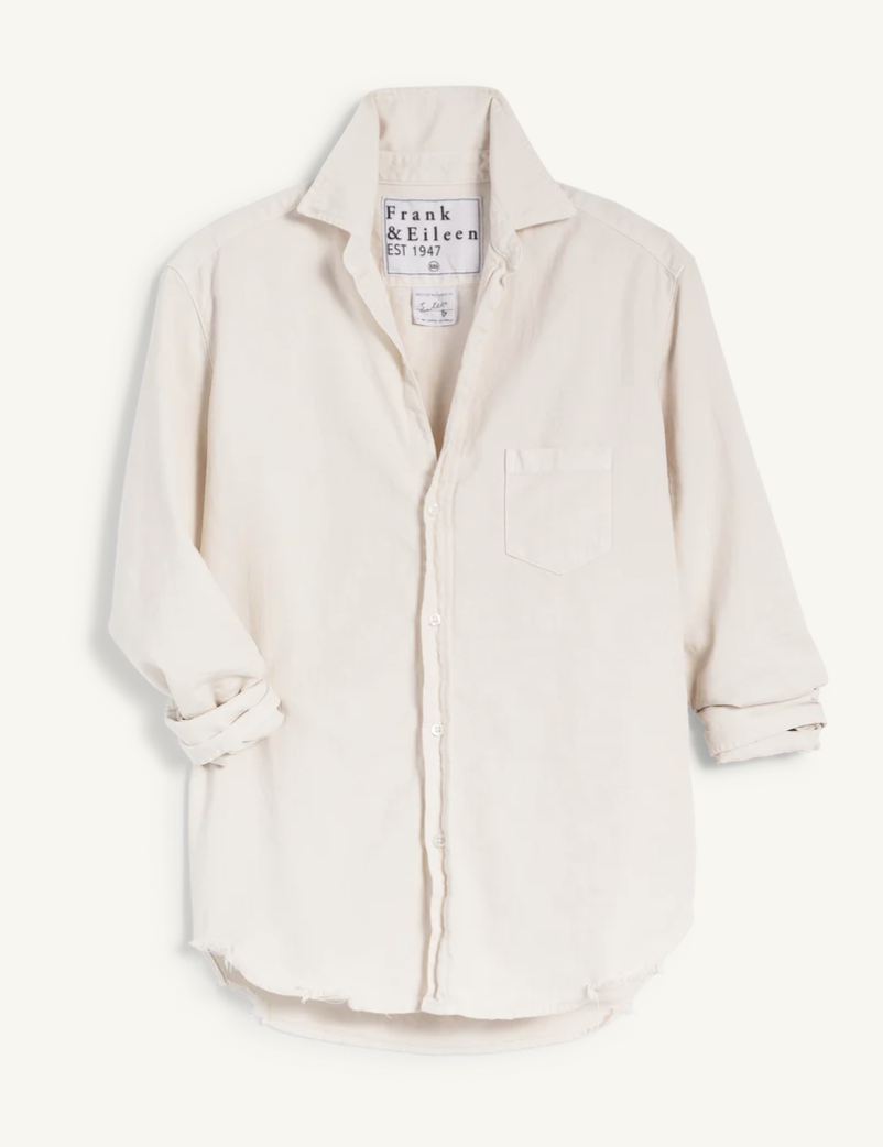 A beige, long-sleeved EILEEN Relaxed Button-Up Shirt by Frank & Eileen, displayed against a white background. The shirt is unbuttoned slightly and has a pocket on the left side that exudes Arizona style.