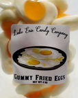 A package of Faire's Lake Erie Candy Assorted Easter Jelly Candy, featuring confectioneries shaped like sunny-side-up eggs, stacked behind the label at a bungalow in Scottsdale Arizona.