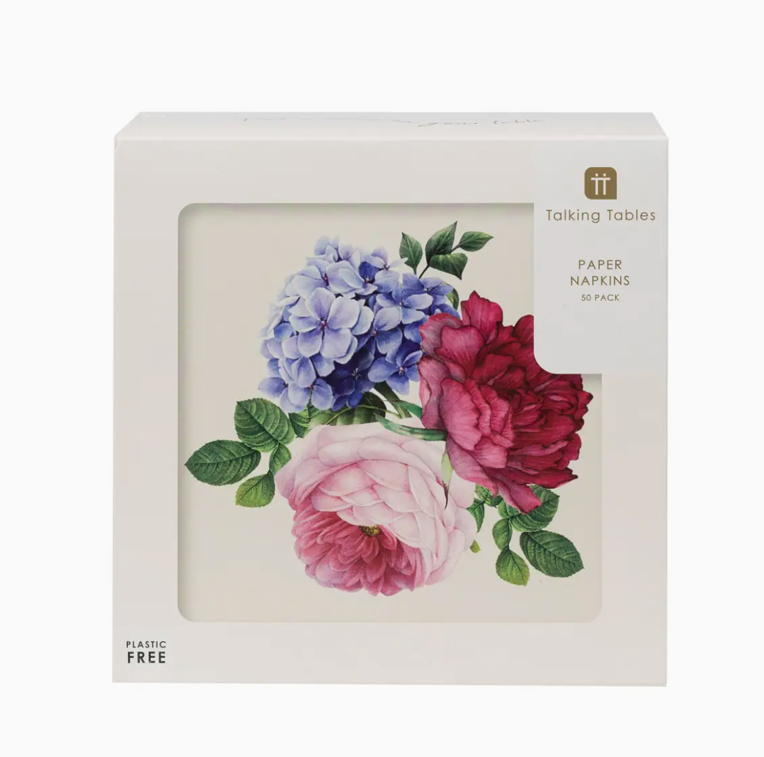 A package of Faire brand Floral Napkins 50Pk, with a floral design featuring blue, pink, and red flowers reminiscent of the vibrant hues seen in Scottsdale Arizona gardens, and green leaves, labeled as a 30-pack and plastic-free.