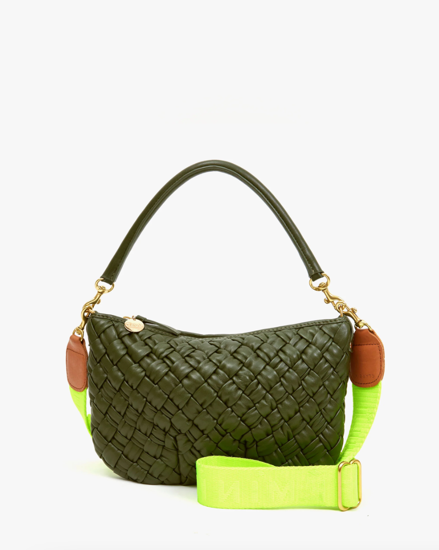 Green woven leather handbag with brown accents and a neon green Clare Vivier Crossbody Strap, displayed against a white background in Arizona style.