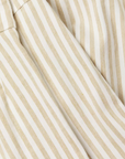 Close-up of a fabric with alternating cream and light beige vertical stripes, reminiscent of a Avenue Montaigne Alex Pant bungalow in Scottsdale, Arizona.