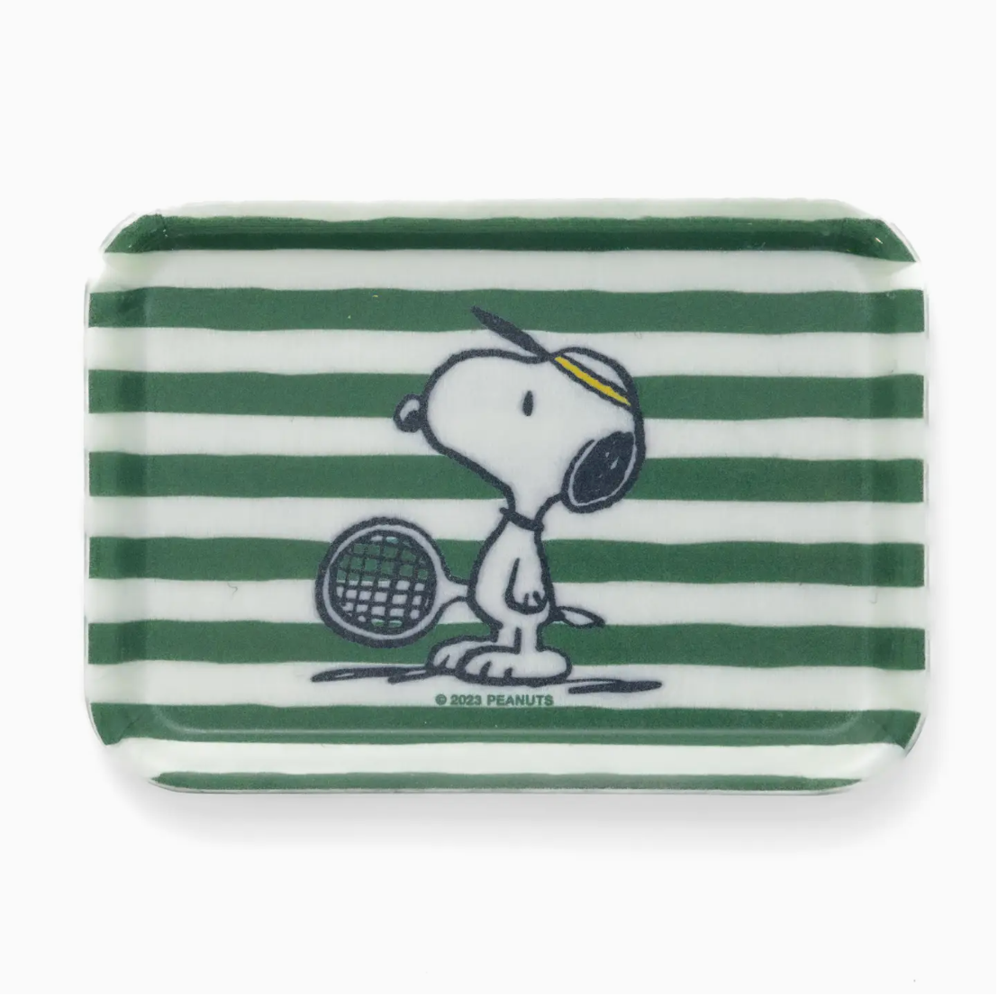 A Peanuts Tray featuring a design of Snoopy from Peanuts, holding a tennis racket, printed on a green and white striped background, inspired by the bungalow style.