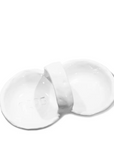 Two white ceramic dishes in Arizona style, one broken in half with the word "YES" visible in the interior of the intact Montes Doggett Appetizer Bowl No. 453 - 1205, set against a plain white background.
