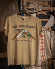 Vintage unisex Made Worn Rolling Stones Americas '75 Tour concert T-shirt, displayed on a wooden frame in a rustic setting with other garments.