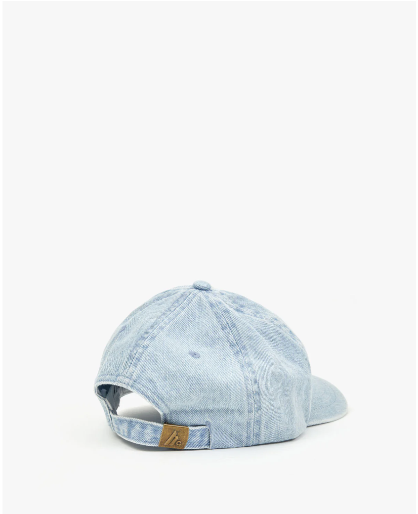 A light blue Clare Vivier Baseball Hat Petit Block Ciao Denim with an adjustable strap, displayed against a white background. The cap features a small brown leather tag on the back and exudes Arizona style.