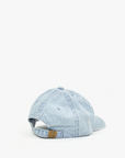A light blue Clare Vivier Baseball Hat Petit Block Ciao Denim with an adjustable strap, displayed against a white background. The cap features a small brown leather tag on the back and exudes Arizona style.