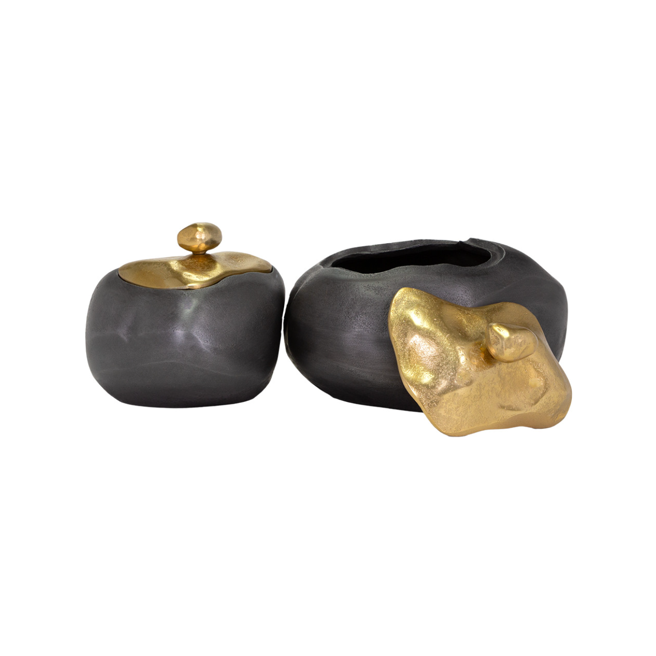 Two Finkle Box decorative ceramic pots with metallic gold details, reminiscent of a Scottsdale Arizona bungalow style; one is completely closed with a round gold lid, and the other is open with a gold accent on the side, all against a white background. (Brand: The Import Collection)