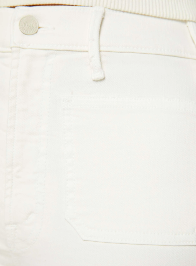 Close-up of a Mother white denim high-rise bootcut with The Hustler Patch Pocket Flood and a metal button and drawstring belt, emphasizing texture and detail.