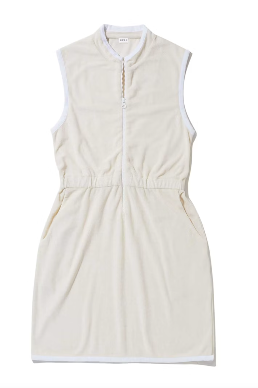 A sleeveless, cream-colored Kule terry dress with a zippered front and two side pockets, displayed against a white background.