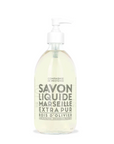The 16.7oz clear glass pump bottle of Cie Luxe Brands Liquid Soap displays "Savon Liquide Marseille Extra Pur Bois d'Olivier" with bold gray text on its minimalist label. Made from nourishing vegetable oils, the soap has a light yellow hue.