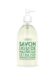 A sleek glass pump bottle with a white dispenser holds "Liquid Soap 16.7oz." The label reads "Savon Liquide Marseille Extra Pur" in green, with "Romarin Vitamine" below. Enriched with vegetable oils, it's from the brand "Cie Luxe Brands," elegantly displayed at the top.