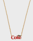 The Faire Coca-Cola Necklace features a gold-tone ball bead chain with a "Diet Coke" charm in red and gold letters, shown against a plain white background.