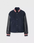 Scarlet varsity jacket with black faux leather sleeves and striped cuffs by Rag & Bone, laid flat.