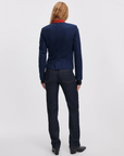 Rag & Bone Sutton Cigarette Jean in blue, styled with a blazer and boots, model shown from the back.