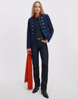 Rag & Bone Sutton Cigarette Jean in classic denim styled with a blue military jacket and black shirt, red scarf accessory.