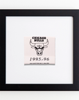 Framed acrylic print depicting the Chicago Bulls logo with the text "CHICAGO BULLS" above and "1995-96" below. Beneath the year, it reads "GRAY ADVERTISING MILES, IOWA 50394" in small font. Black frame with white background. The product is Art Square Blk Frame by Match South.