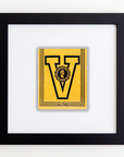 A Match South Art Square Blk Frame with a large black letter "V" in the center, featuring an image of a Roman soldier’s head inside a circular emblem below the "V." The frame is black and simple in design, with a white background inside. This stylish piece brings a modern touch to any space, perfect for those who appreciate striking prints.