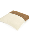 The Gus Pillow by Libeco Home is a square throw pillow with a two-tone design—light beige on the bottom, brown on top—separated by dark brown stitched lines. It pairs easily with other luxurious pillows or your favorite insert.