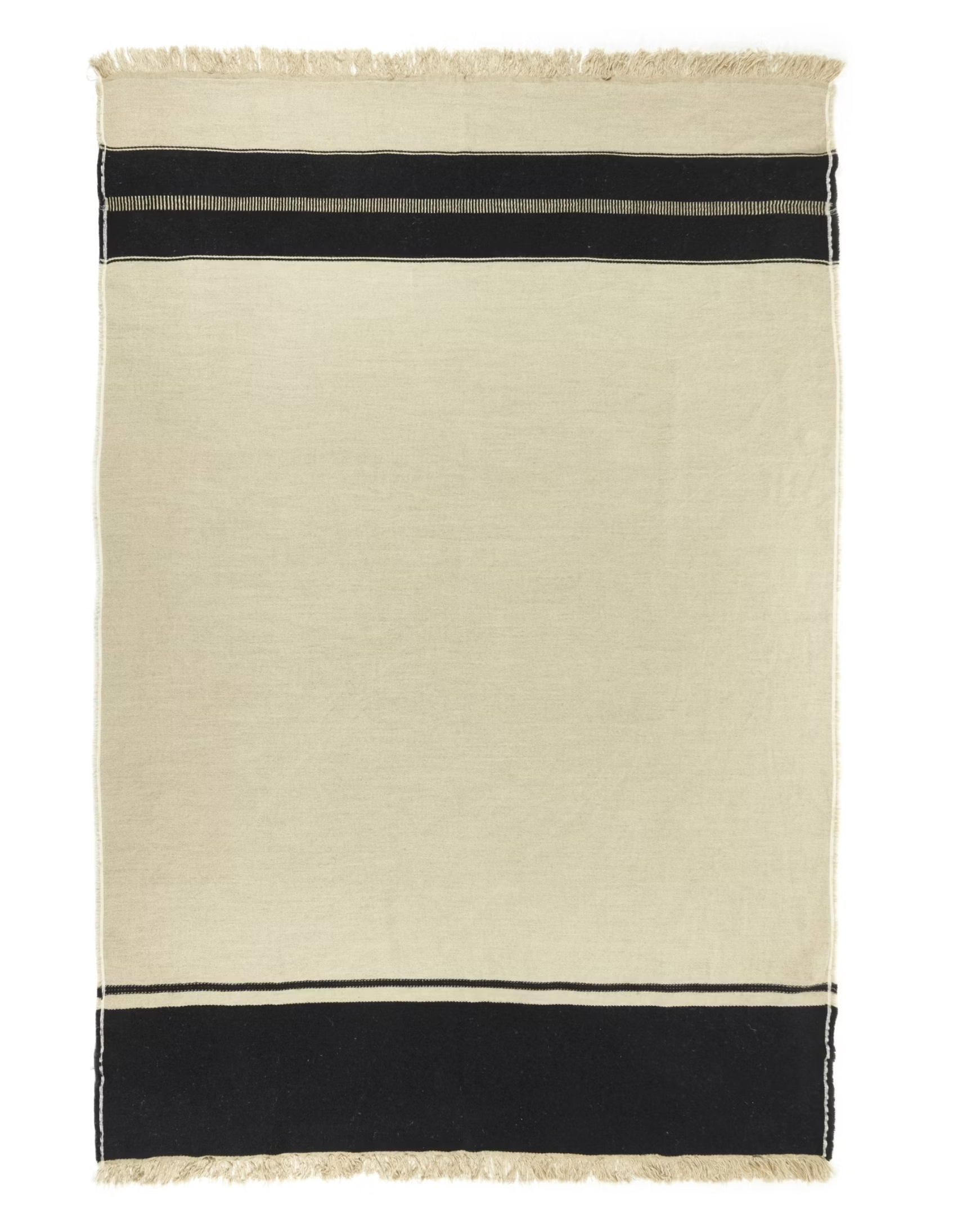 The Marshall Throw by Libeco Home is a rectangular beige linen-wool blend with flax fringe, fringed edges, and two black stripes near the top and bottom for a minimalist, timeless look.