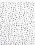 Close-up of the John Robshaw Coverlet Queen: white organic cotton voile with a gathered texture and subtle blue accents. The fabric’s edge appears along the top and left sides.
