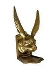 The Rabbit Bookend Set by Fox Run Brands features gold-colored, heavy duty bookends shaped like jackrabbit heads with tall ears on rectangular bases—a functional and stylish addition to your shelves.