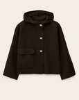 The BA&SH Jacket Kove is a cropped wool coat with a wide collar, long sleeves, a left front flap pocket, and four square gold-tone buttons. Its loose fit and minimal design create a modern, relaxed look.