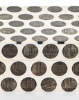 The Two's Company Dot Chiseled Covered Box features a white rectangular design with bold black dots, offering a stylish, handcrafted accent for decorative storage or unique resin decor.