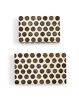 Two's Company Dot Chiseled Covered Boxes, handcrafted and rectangular, feature cream paper with large black polka dots. Shown stacked on a white background, the boxes are different sizes.