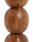 The Pillar Candleholder by Two's Company features four smooth, round, stacked spheres with natural wood grain, offering a hand-crafted look inspired by mid-century modern design.
