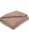 The Libeco Home Swimmers Stripe King Duvet, featuring light brown stripes and a washed finish, is folded and placed on a plain white surface.